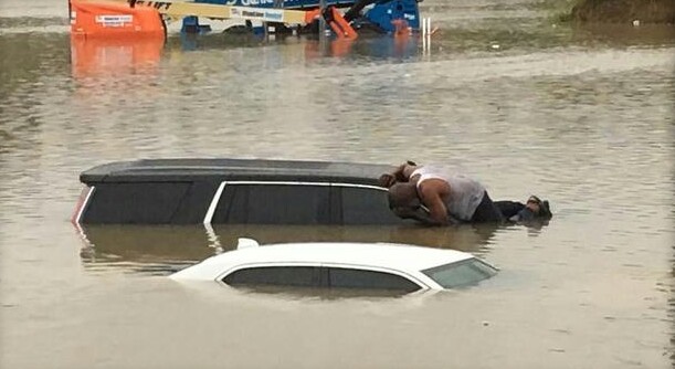 Houston Pastor Checks Submerged Cars to Ensure No One is Trapped